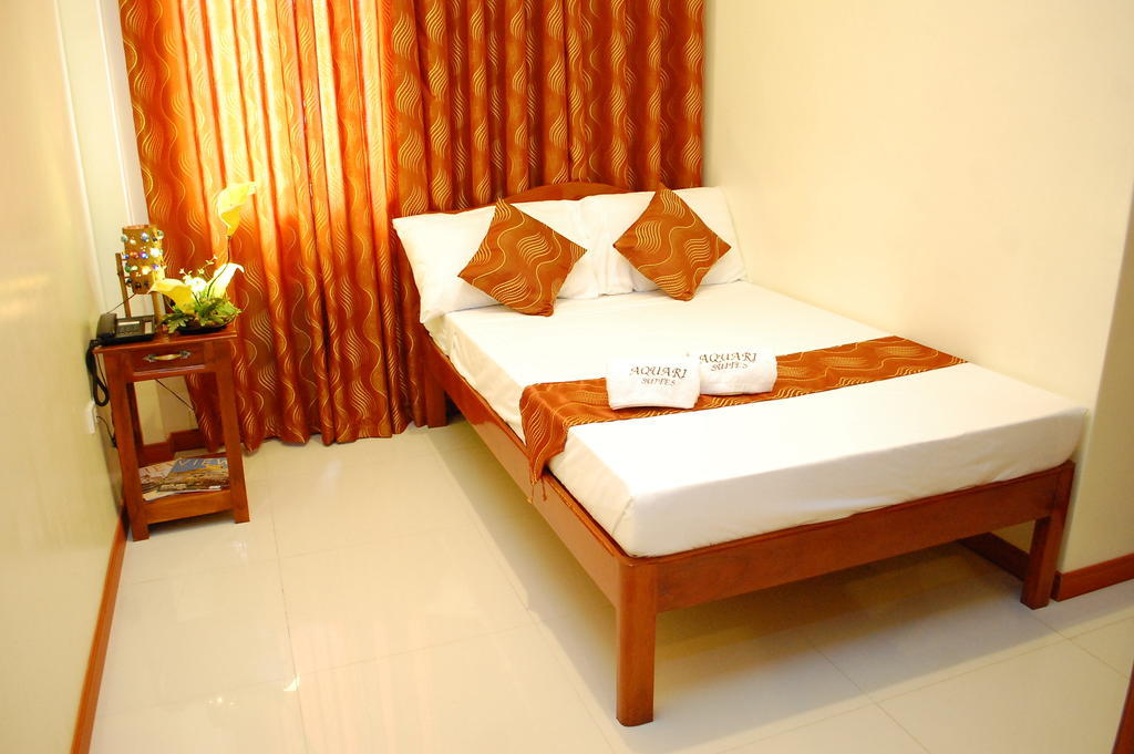 Aquari Travelers Suites Puerto Princesa Rum bild